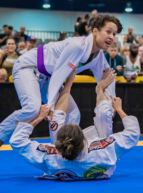Women's Self-Defense instructor fighting at an IBJJF tournament