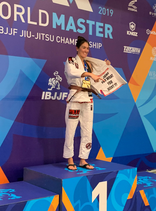 Brianne Corral on the podium after winning IBJJF World Master 2019